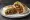 Burrito de Carne Asada: an illustration of beef, guacamole and salsa on tortilla.