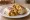 Burrito de Desayuno: an illustration of egg, pork, potato and cheese on tortilla.