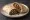 Burrito de Deshebrada: an illustration of beef, onion and cilantro on tortilla.