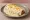 Burrito Suizo: an illustration of beef, sour cream and cheese on tortilla.
