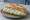 Cacık Ekmek: an illustration of yogurt, cucumber, garlic, mint and more on bread.