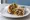 Carnitas Burrito: an illustration of pork, beans, rice, guacamole and more.