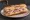 Casse-Croûte: an illustration of ham and butter on baguette.