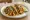 Cauliflower Taco: an illustration of cilantro, onion, lime and salsa on corn tortilla.