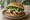 Cemita: an illustration of beef, avocado and onion.