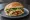 Cemita de Carne Enchilada: an illustration of pork, avocado and onion.