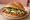 Cemita de Milanesa: an illustration of beef, avocado and onion.