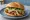 Cemita de Pierna: an illustration of pork, avocado and onion.