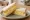 Cheese and Onion: an illustration of cheddar cheese, onion and butter on white bread.