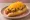 Cheese Coney: an illustration of hot dog, pepper, cheddar cheese, onion and more on hot dog bun.