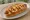 Cheese Dog (チーズドッグ): an illustration of hot dog, cheese, ketchup and mustard on hot dog bun.