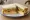 Cheese Salad Sandwich: an illustration of cheddar cheese, lettuce, tomato, cucumber and more on white bread.