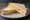 Cheese Sandwich: an illustration of cheddar cheese and butter on white bread.