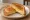 Cheese Toastie: an illustration of cheddar cheese and butter on white bread.