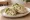 Chicken Caesar Wrap: an illustration of chicken, parmesan, lettuce and caesar dressing on tortilla.