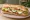 Chicken Cutlet Hero: an illustration of chicken, mozzarella, lettuce, tomato and more on hoagie roll.