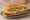 Chicken Cutlet Hoagie: an illustration of chicken, provolone, lettuce, tomato and more on hoagie roll.