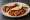 Chicken Fajita: an illustration of chicken, pepper, onion and lime on tortilla.