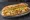 Chicken Fillet Roll: an illustration of chicken, butter, lettuce, tomato and more on baguette.