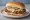 Chicken Fried Steak Sandwich: an illustration of beef, pepper and pickle on white bread.