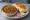 Chicken Keema Pav: an illustration of chicken, onion, tomato, ginger and more on bread.