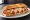 Chicken Parm Hero: an illustration of chicken, mozzarella, marinara and parmesan on hoagie roll.