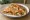 Chicken Quesadilla (USA): an illustration of chicken, cheese, pepper and onion on tortilla.