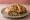 Chicken Seekh Roll: an illustration of chicken, onion, ginger, garlic and more on naan.