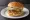 Chicken Tikki Burger: an illustration of chicken, onion, lettuce and mayonnaise on burger bun.