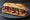 Chinese Roast Pork Sandwich: an illustration of pork and scallion on baguette.