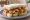 Chip Butty with Gravy: an illustration of gravy and butter on white bread.