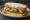 Chip Butty with Mushy Peas: an illustration of butter on white bread.