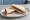 Chocolate Spread: an illustration of chocolate hazelnut spread and butter on white bread.