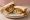 Chop Sandwich: an illustration of fish, mutton, onion, potato and more on white bread.