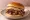 Chopped Brisket: an illustration of beef, pickle and onion on burger bun.