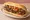 Choripán Completo: an illustration of pork, sausage, chimichurri, tomato and more on baguette.