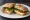 Ciabatta Sandwich: an illustration of mozzarella, tomato, arugula and olive oil on ciabatta.