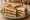 Club Sandwich: an illustration of turkey, bacon, lettuce, tomato and more on white bread.