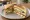 Club Sandwich Indian Style: an illustration of cucumber, tomato and onion on white bread.
