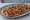 Coca de Recapte: an illustration of anchovy, pepper, eggplant, onion and more.