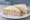 Coleslaw Sandwich: an illustration of coleslaw, cabbage, carrot and mayonnaise on white bread.
