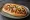 Completo Mexicano: an illustration of pork, bacon, beans, tomato and more on hot dog bun.