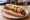 Coney Island Hot Dog (Michigan): an illustration of beef, onion and mustard on hot dog bun.