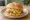 Connecticut Steamed Cheeseburger (Ted's): an illustration of beef and cheddar cheese on kaiser roll.