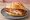 Cordon Bleu Brötchen: an illustration of pork, ham and cheese on kaiser roll.