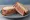 Corned Beef Sandwich: an illustration of corned beef and mustard on rye bread.