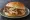 Cornell Chicken Sandwich: an illustration of chicken and egg on burger bun.