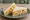 Coronation Chicken with Almonds: an illustration of chicken, mayonnaise, curry powder, chutney and more on white bread.
