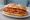 Cotoletta Sandwich con Pomodoro: an illustration of veal, egg, tomato and butter on kaiser roll.