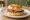 Country Ham Biscuit: an illustration of ham and butter on buttermilk biscuit.